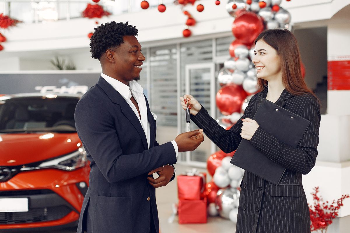 Car keys being handed back to a customer after local collection and delivery